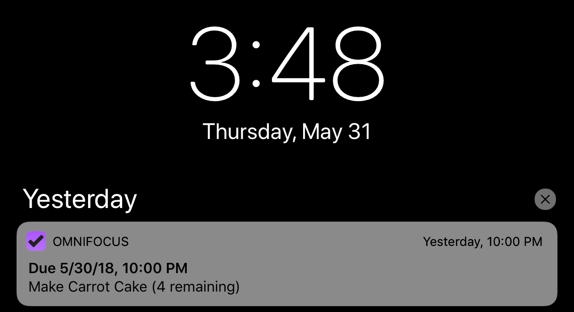 Notification Center on iOS with an OmniFocus notification displayed.